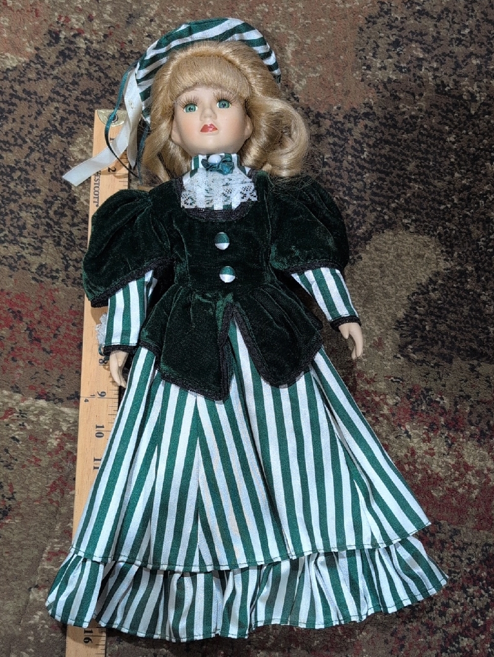 Porcelain Doll With Velvet Green And Striped Dress
